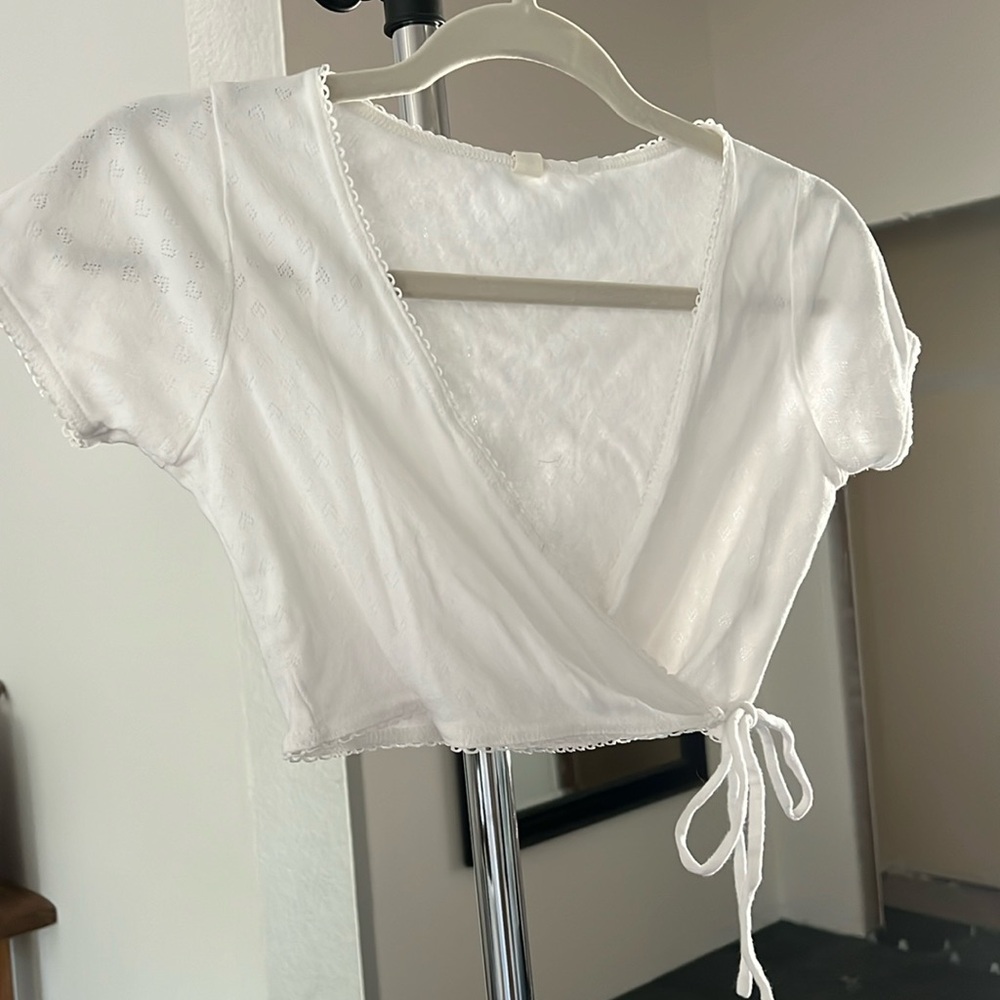 Delicate white short sleeved crop wrap top